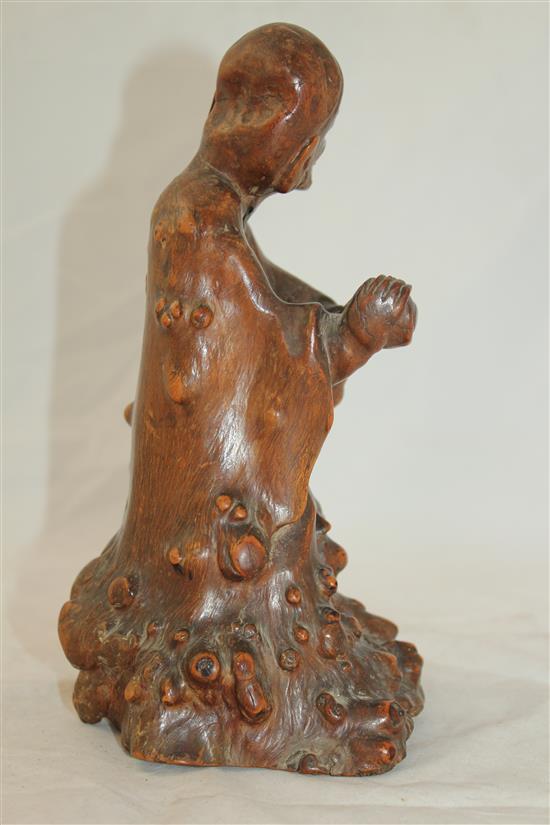 A Chinese rootwood carving of a luohan, 18th century, 23cm